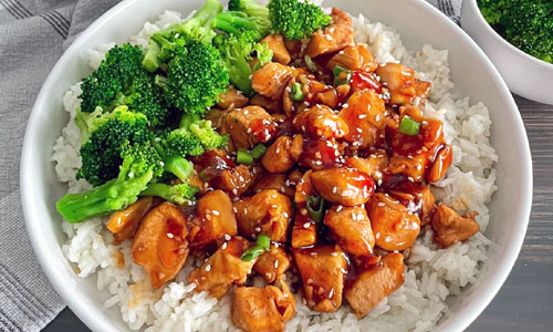 A nutritious Teriyaki Rice Plate with crisp steamed broccoli and seasoned tofu